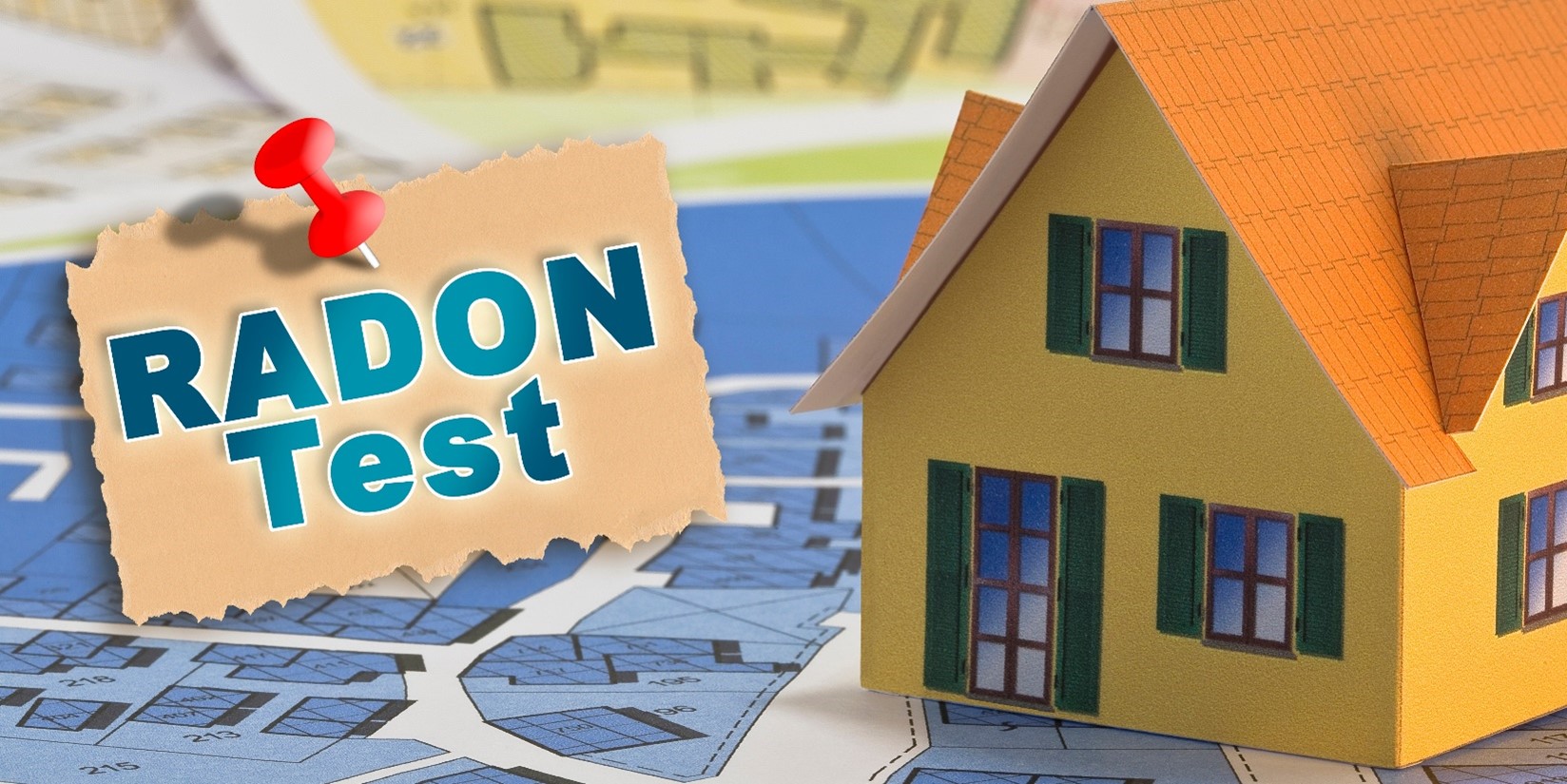 A yellow cardboard home on top of a blueprint next to the words RADON Test.