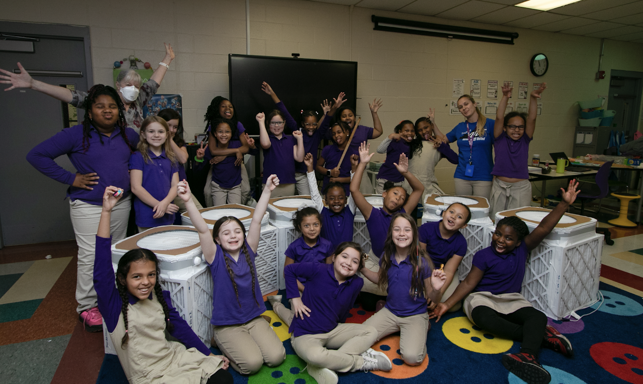 kids in classroom doing a box fan project